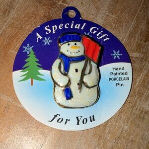 Porcelain Snowman Pin with Blue and Red Accents